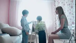 Mother Teaches Little Son To Write the Figures | Stock Footage - Envato elements