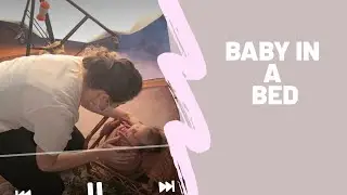 How to pose a baby in a bed