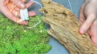 Just combine driftwood, moss and LED garland and you've got...