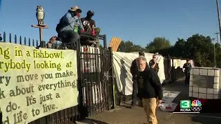 Sacramento police close streets as people barricade themselves in encampment